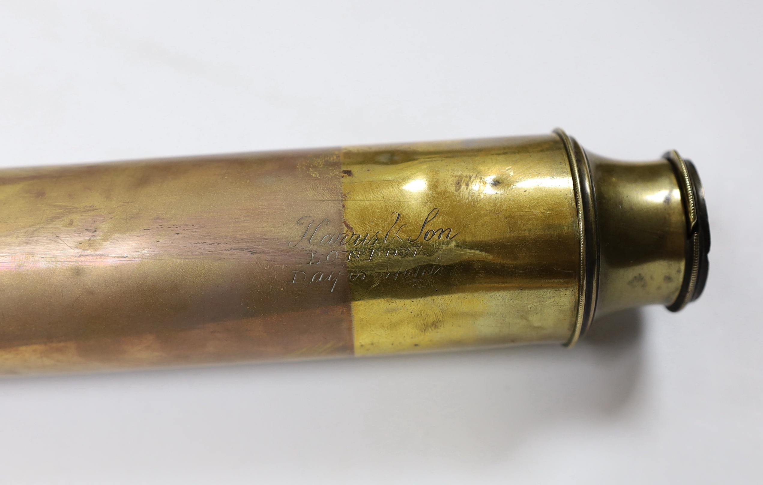 A ship’s brass binnacle containing a Sestrel compass and with a built in oil lamp, a bronze circular stand and a single draw telescope, binnacle 23cm high